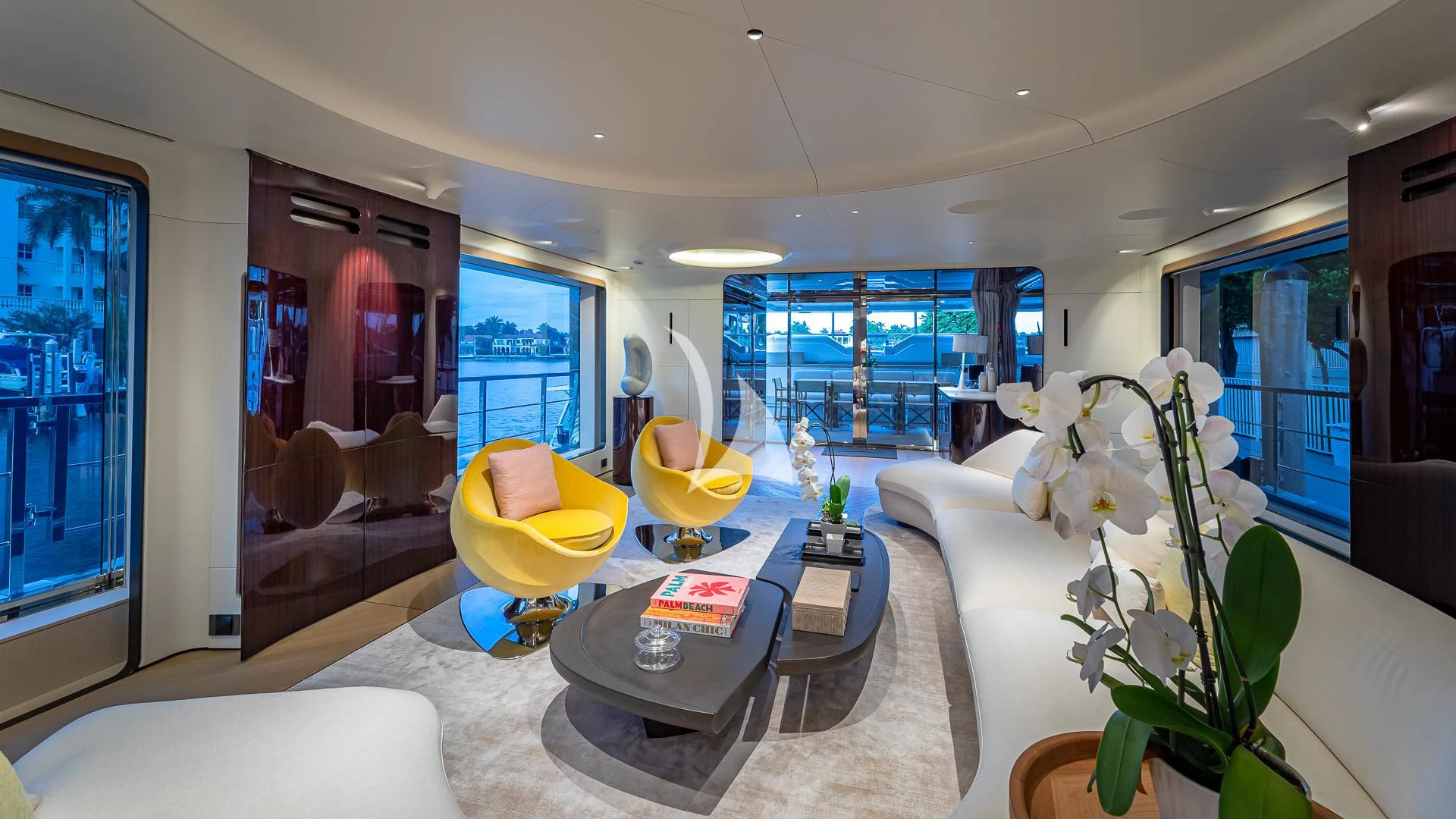a living room with a large window aboard VOLO MARE Yacht for Charter