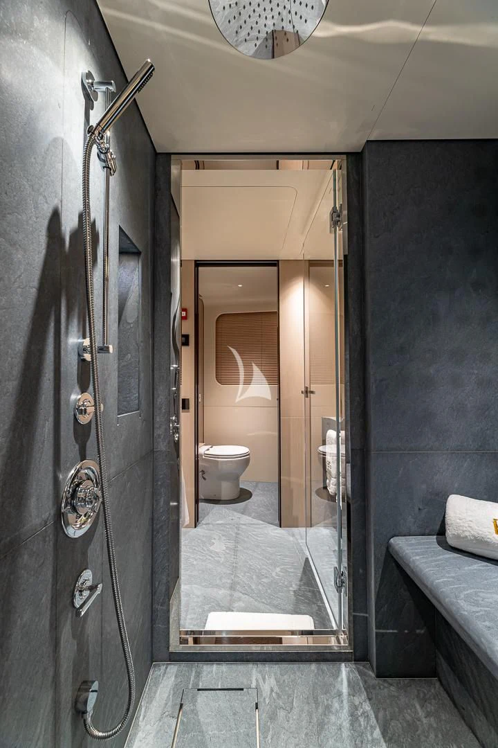 a bathroom with a glass shower aboard VOLO MARE Yacht for Charter