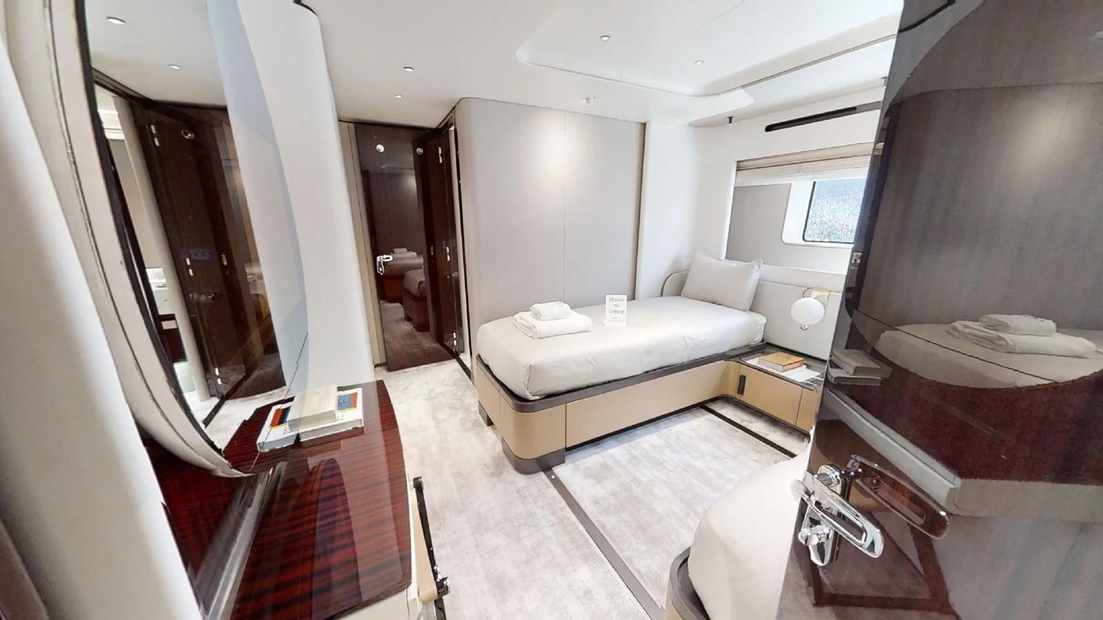 a room with a bed and a desk aboard VOLO MARE Yacht for Charter