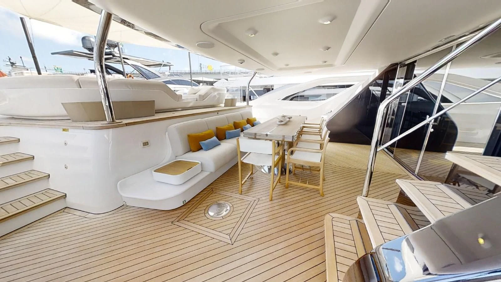 a room with a table chairs and a bed aboard VOLO MARE Yacht for Charter
