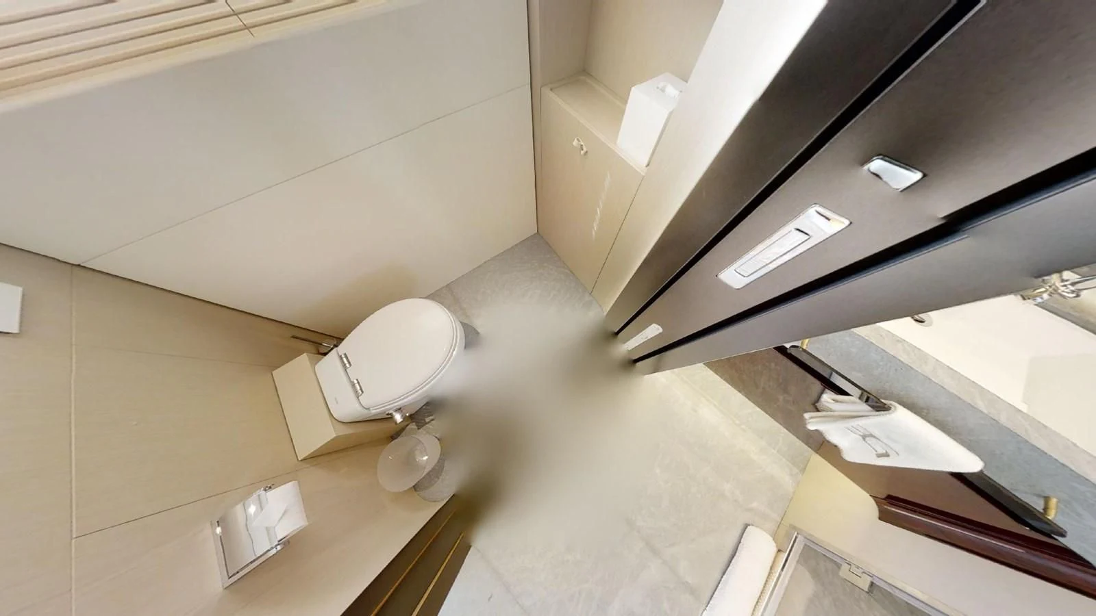 a room with a toilet and a shelf with a mirror aboard VOLO MARE Yacht for Charter