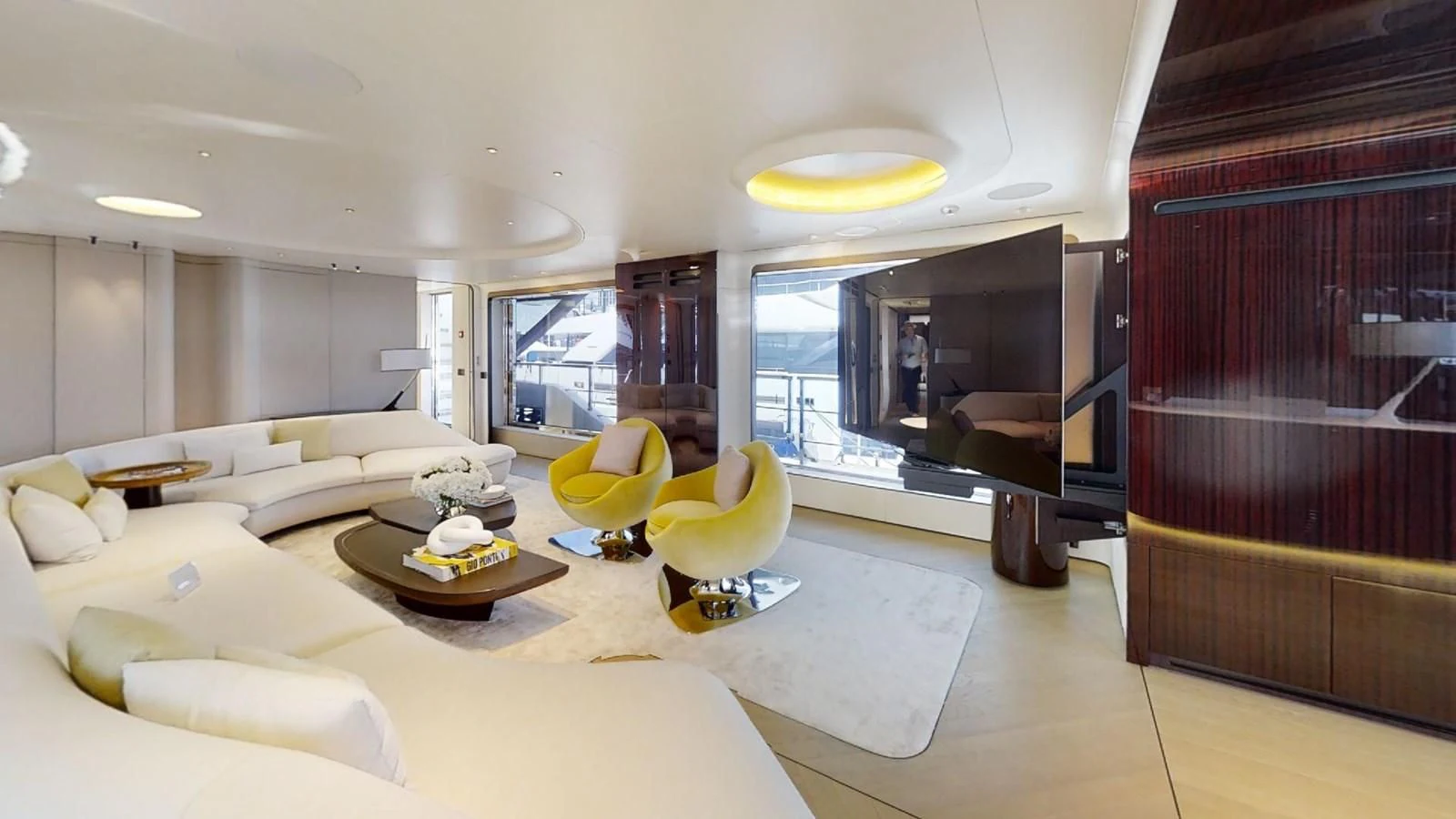 a living room with a large window aboard VOLO MARE Yacht for Charter