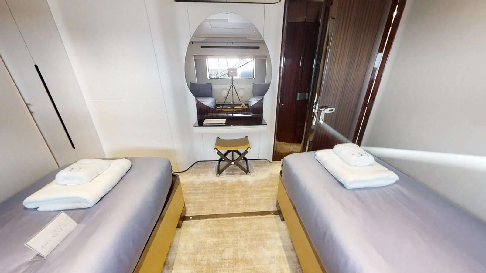 a room with a bed and a fireplace aboard VOLO MARE Yacht for Charter