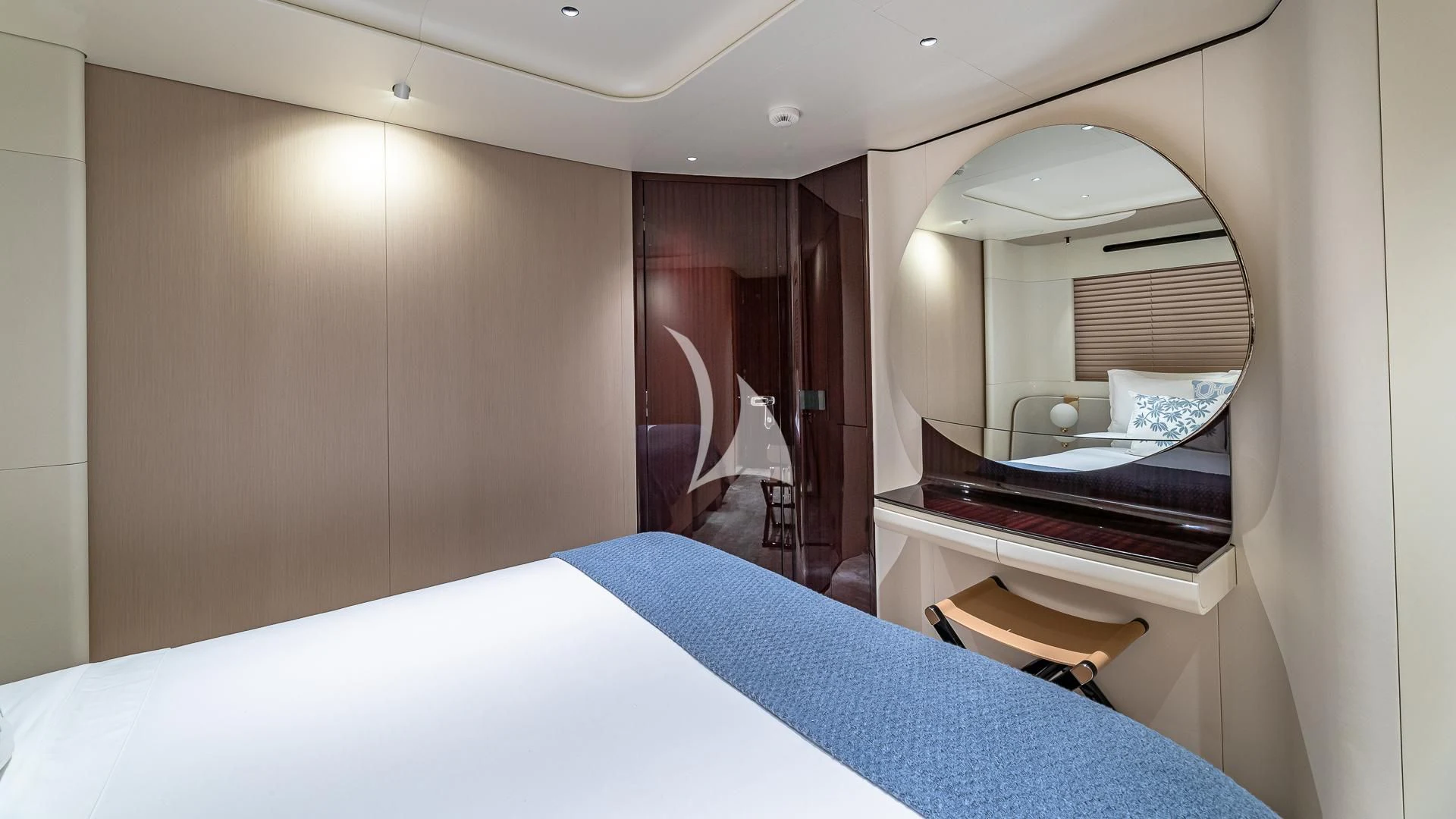 a bed with a mirror above it aboard VOLO MARE Yacht for Charter