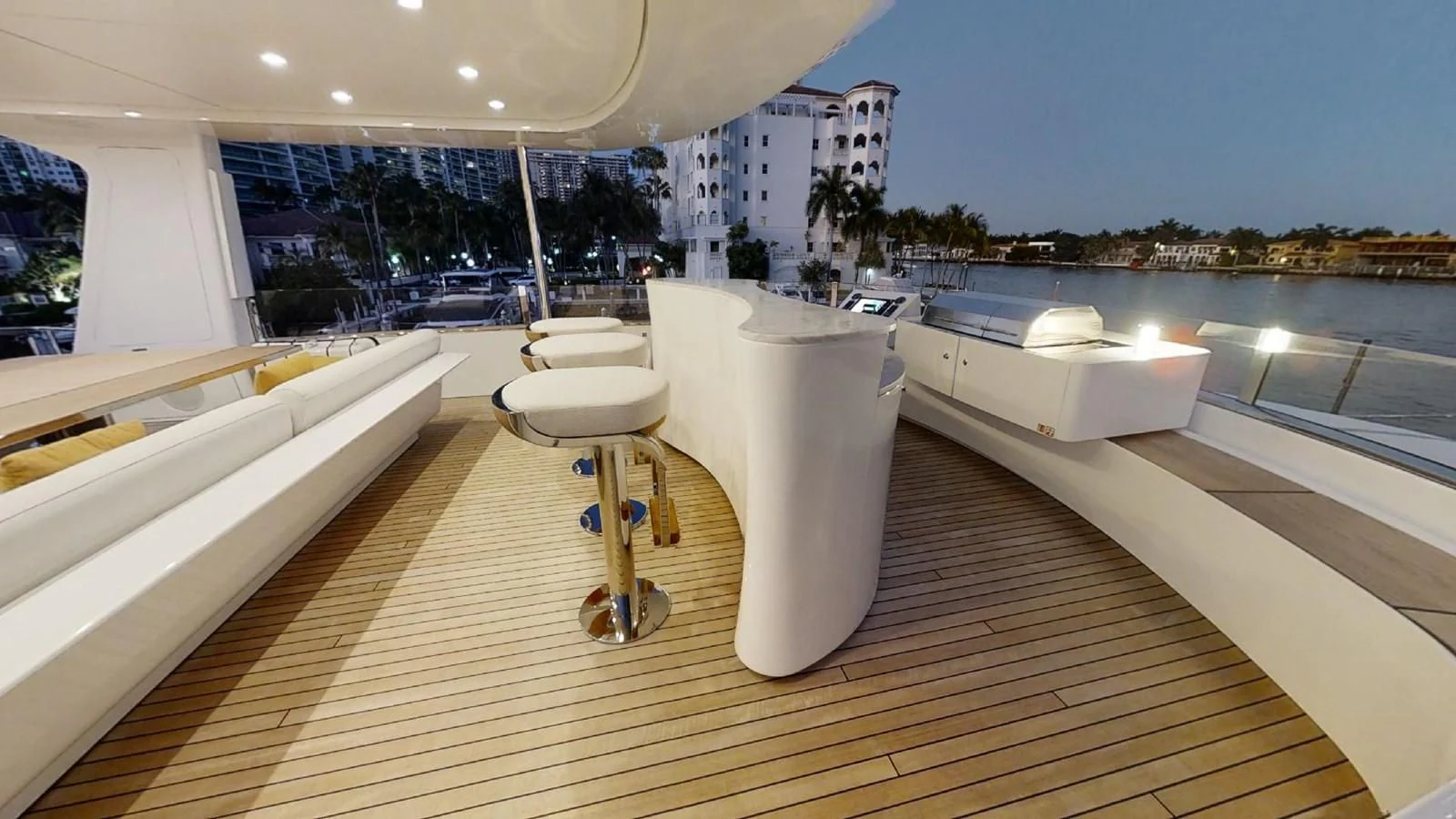 a deck with a tub and a table on it aboard VOLO MARE Yacht for Charter