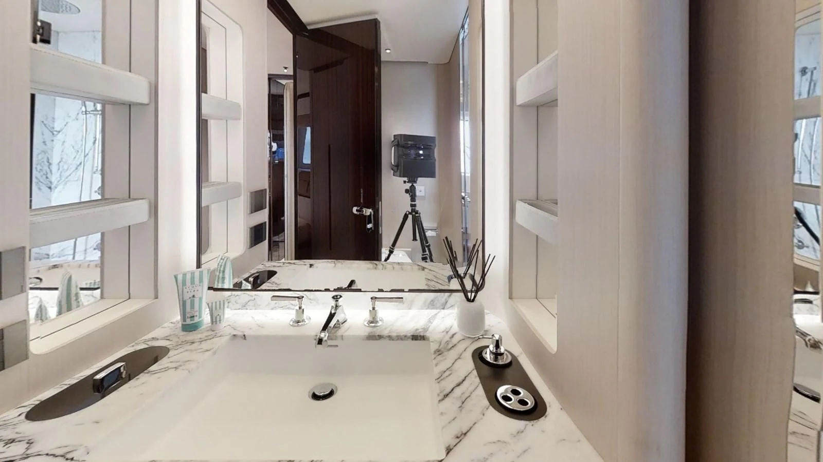 a bathroom with a large mirror aboard VOLO MARE Yacht for Charter