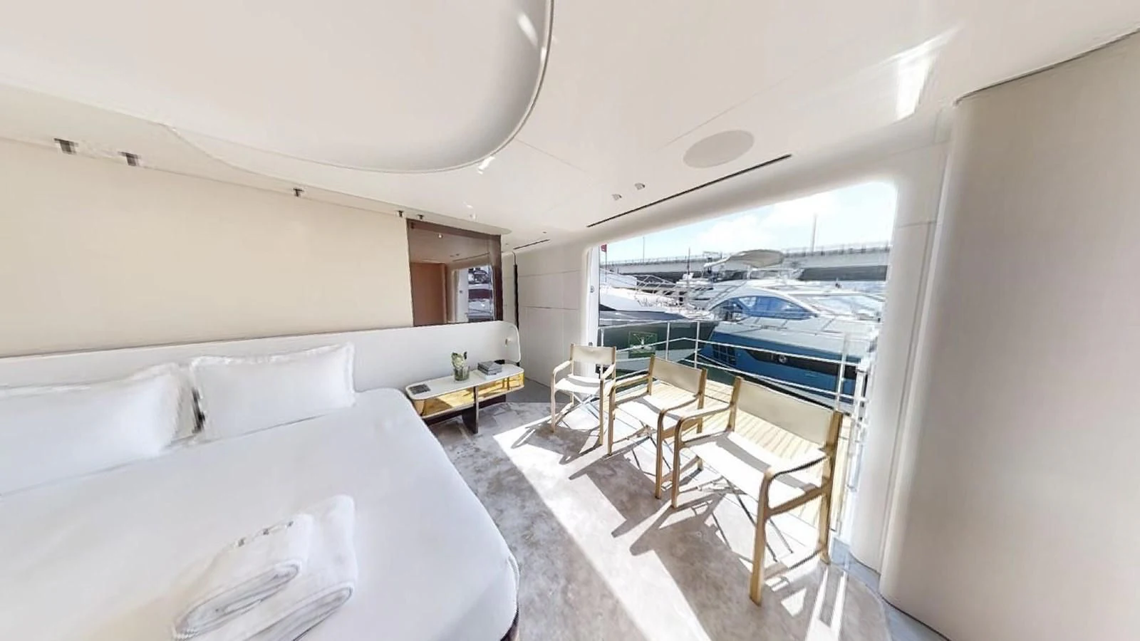 a room with a bed and a table aboard VOLO MARE Yacht for Charter