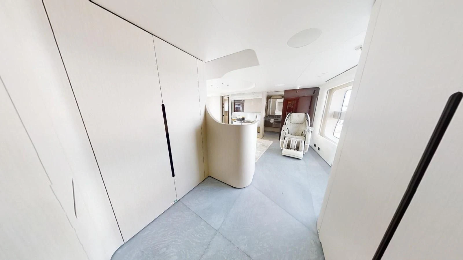a hallway with a door and a chair aboard VOLO MARE Yacht for Charter