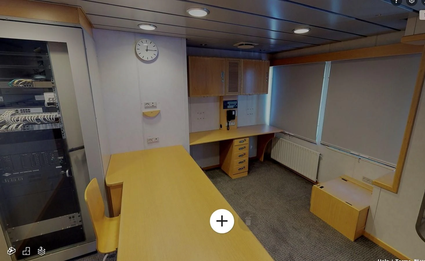 a room with a desk and a clock aboard OCEAN XPLORER 71 Yacht for Sale