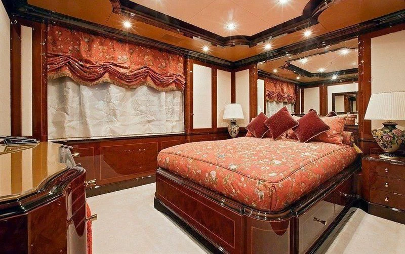 a large bed in a room aboard AUSTRALIA Yacht for Sale