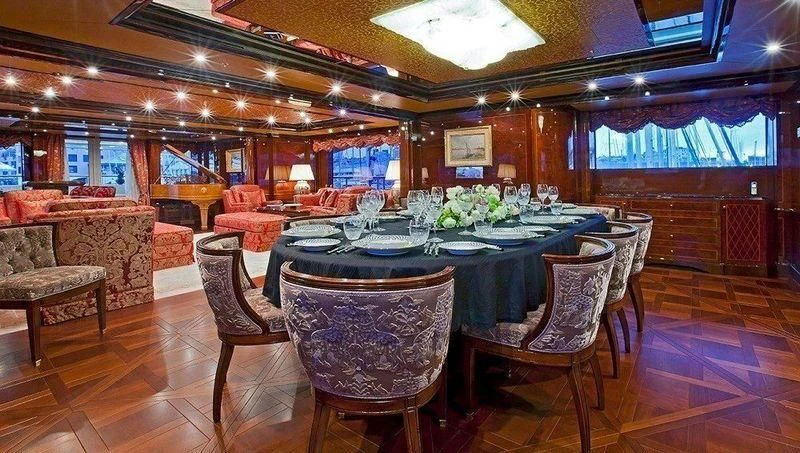 a large dining room with a table and chairs aboard AUSTRALIA Yacht for Sale