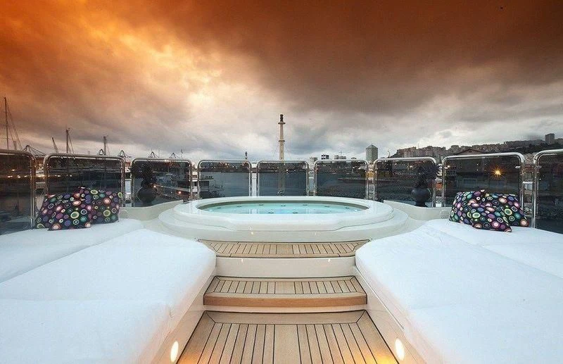 a room with a view of a city and the sunset aboard AUSTRALIA Yacht for Sale