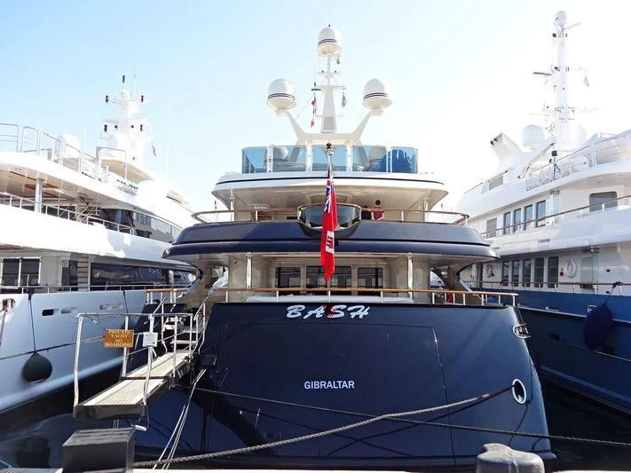 a large boat docked at a pier aboard AUSTRALIA Yacht for Sale