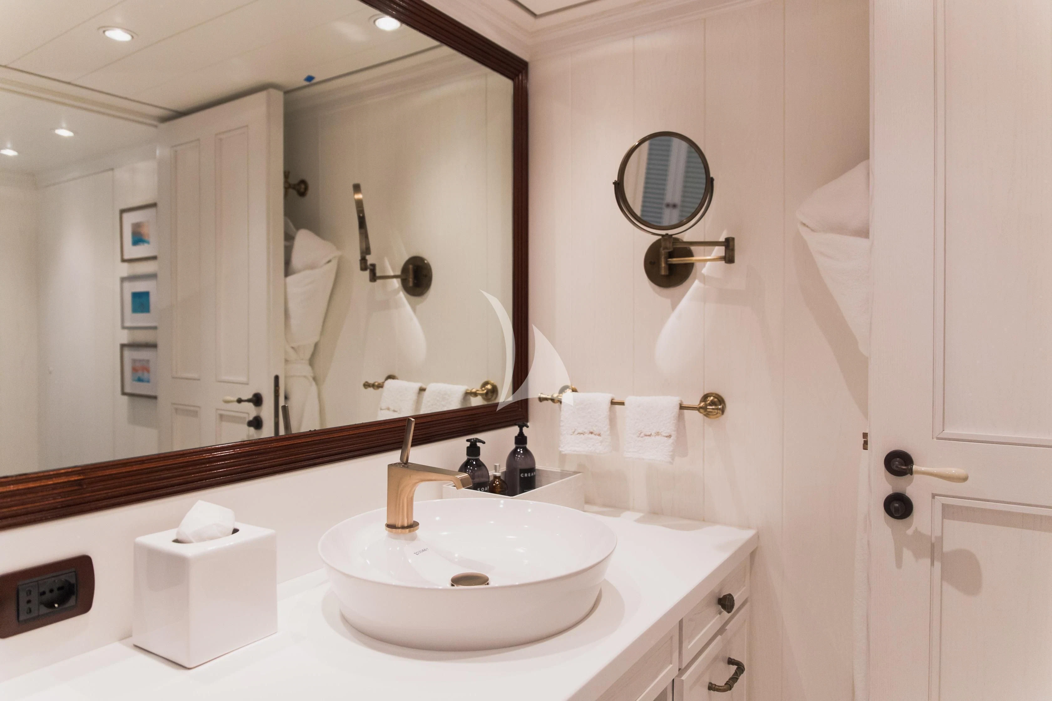 a bathroom with a large mirror aboard LADY TRUDY Yacht for Charter