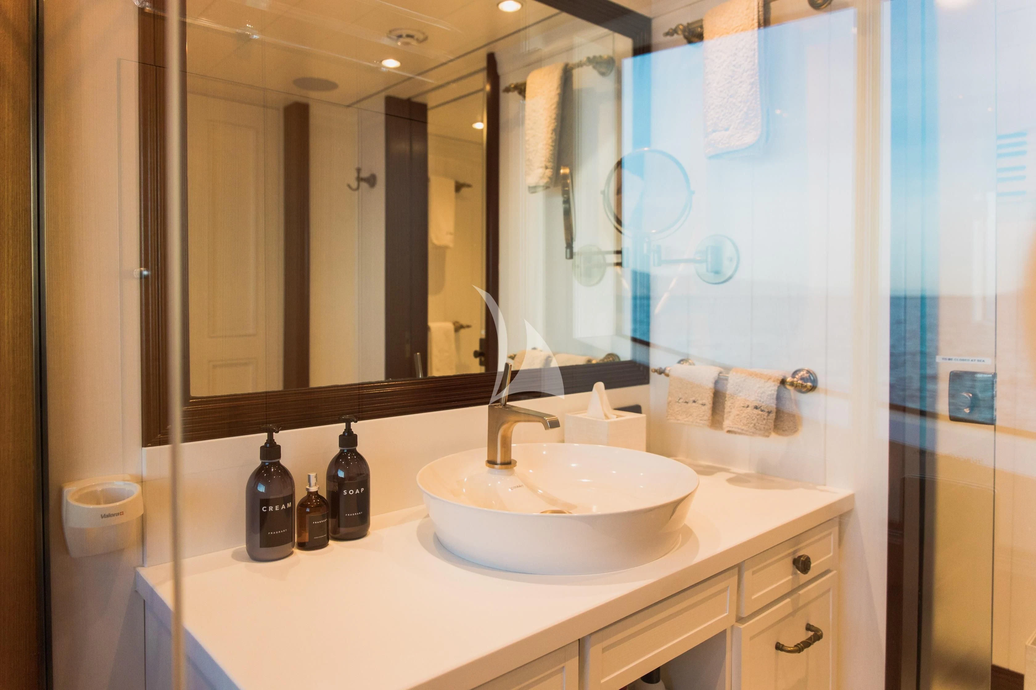 a bathroom with a large mirror aboard LADY TRUDY Yacht for Charter