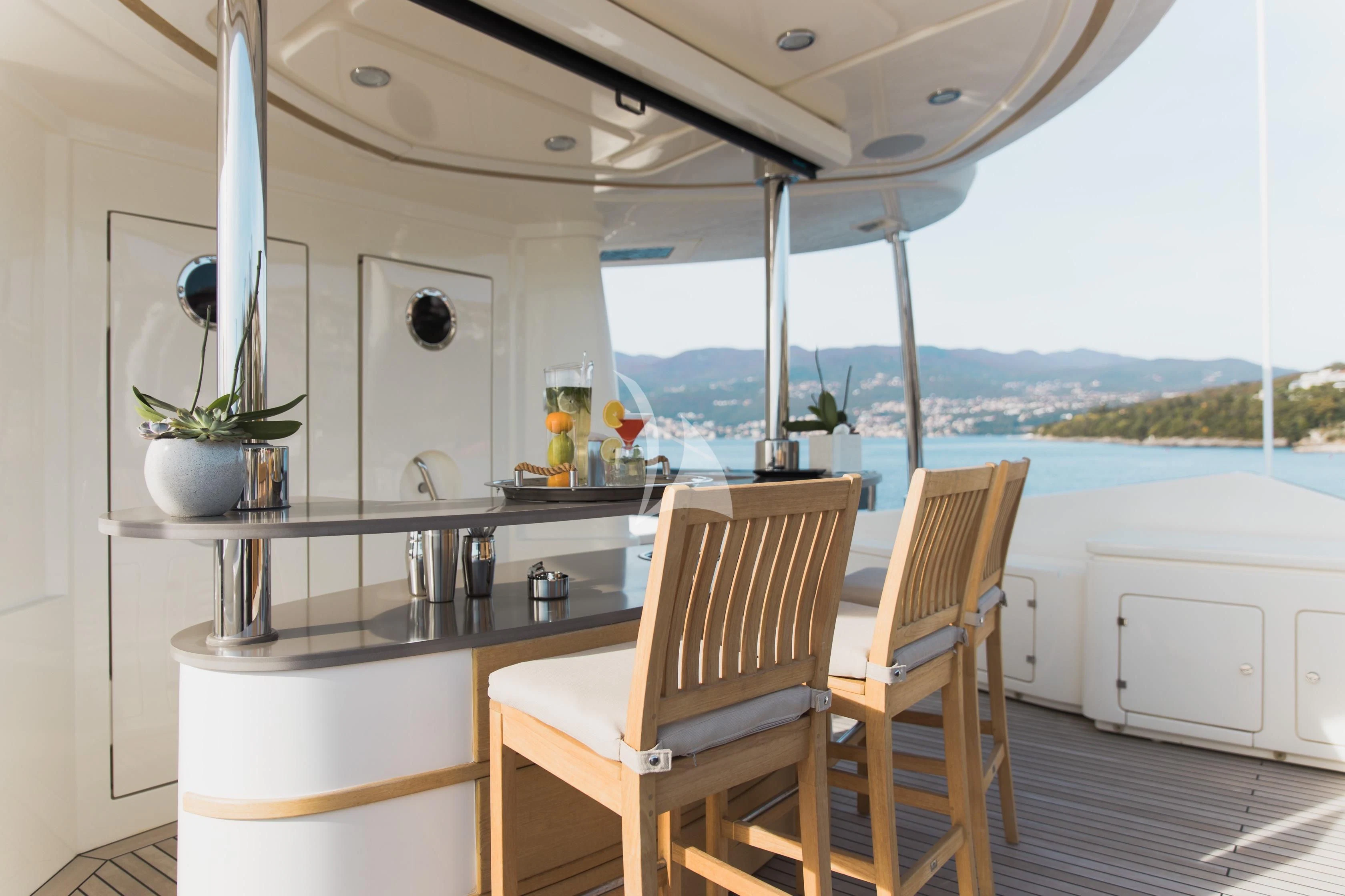 a kitchen with a table and chairs aboard LADY TRUDY Yacht for Charter