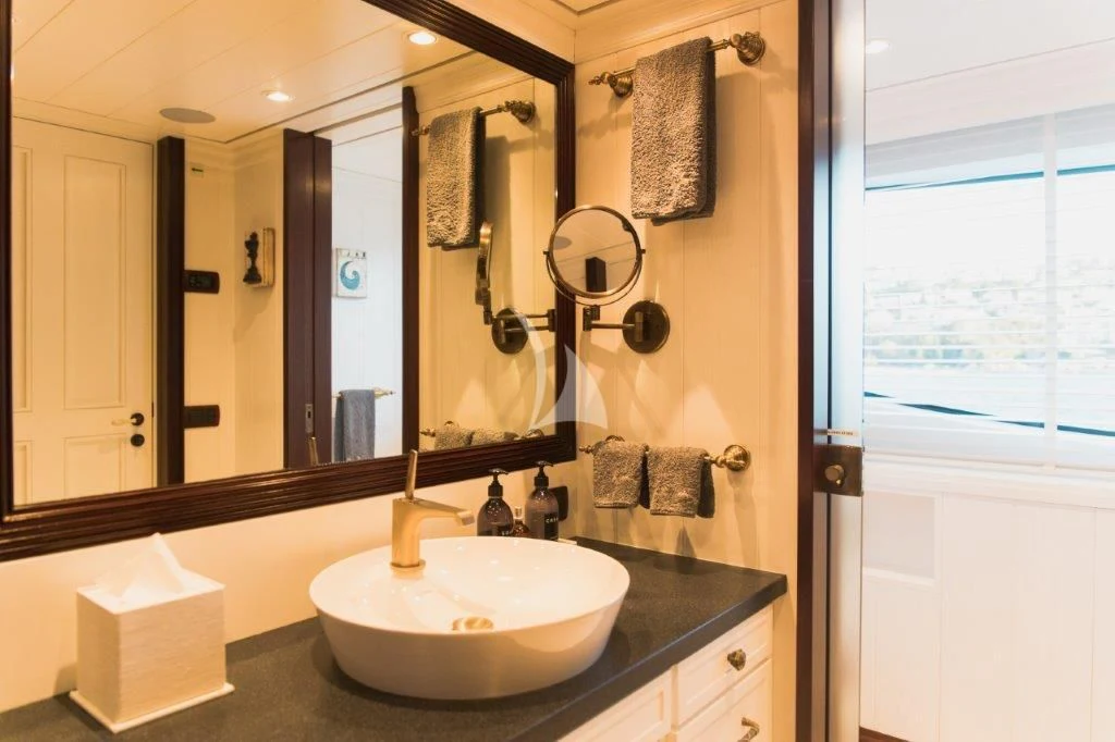 a bathroom with a sink and mirror aboard LADY TRUDY Yacht for Charter