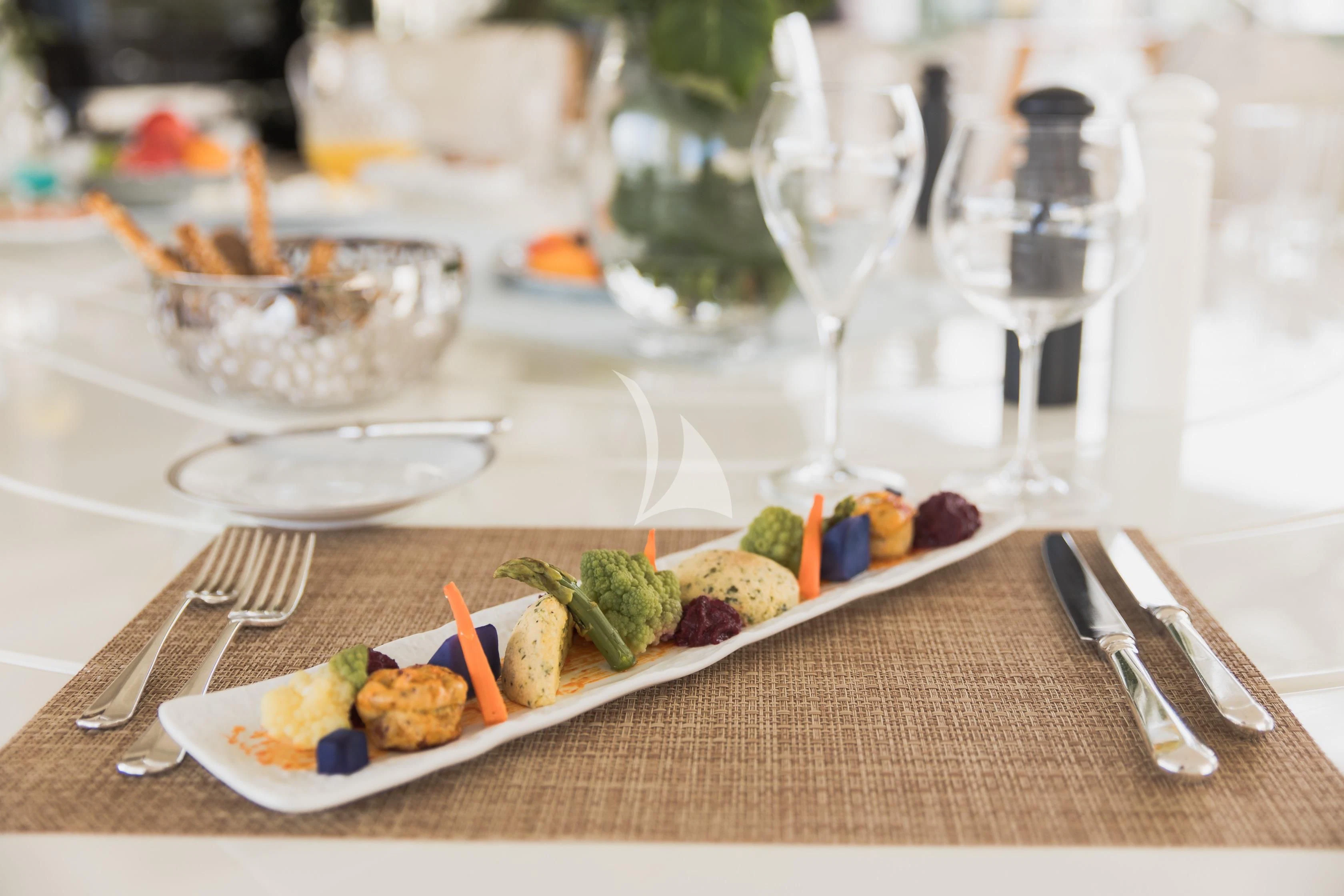 a table with food and glasses aboard LADY TRUDY Yacht for Charter