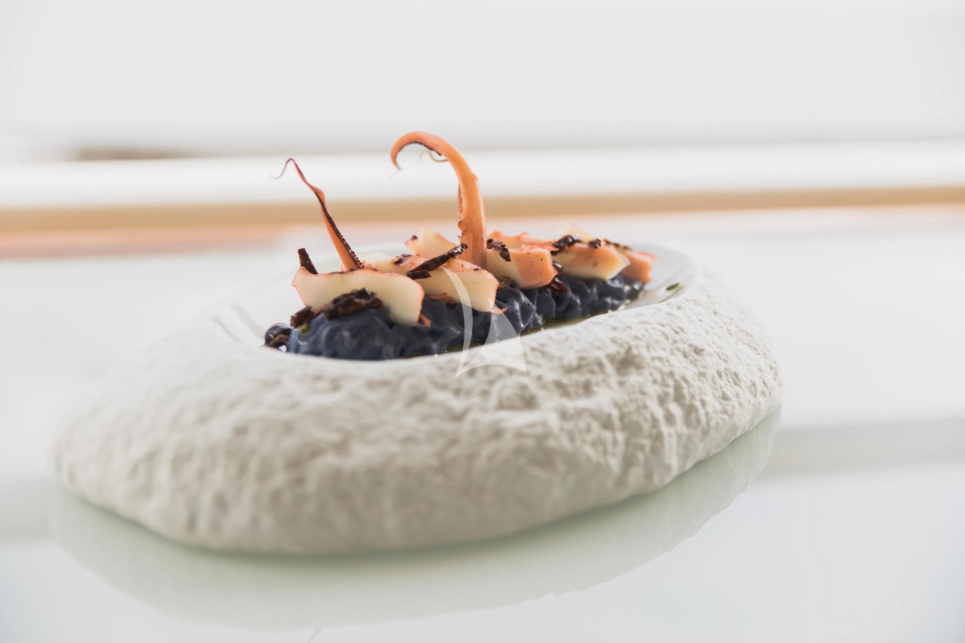 a small insect on a plate aboard LADY TRUDY Yacht for Charter