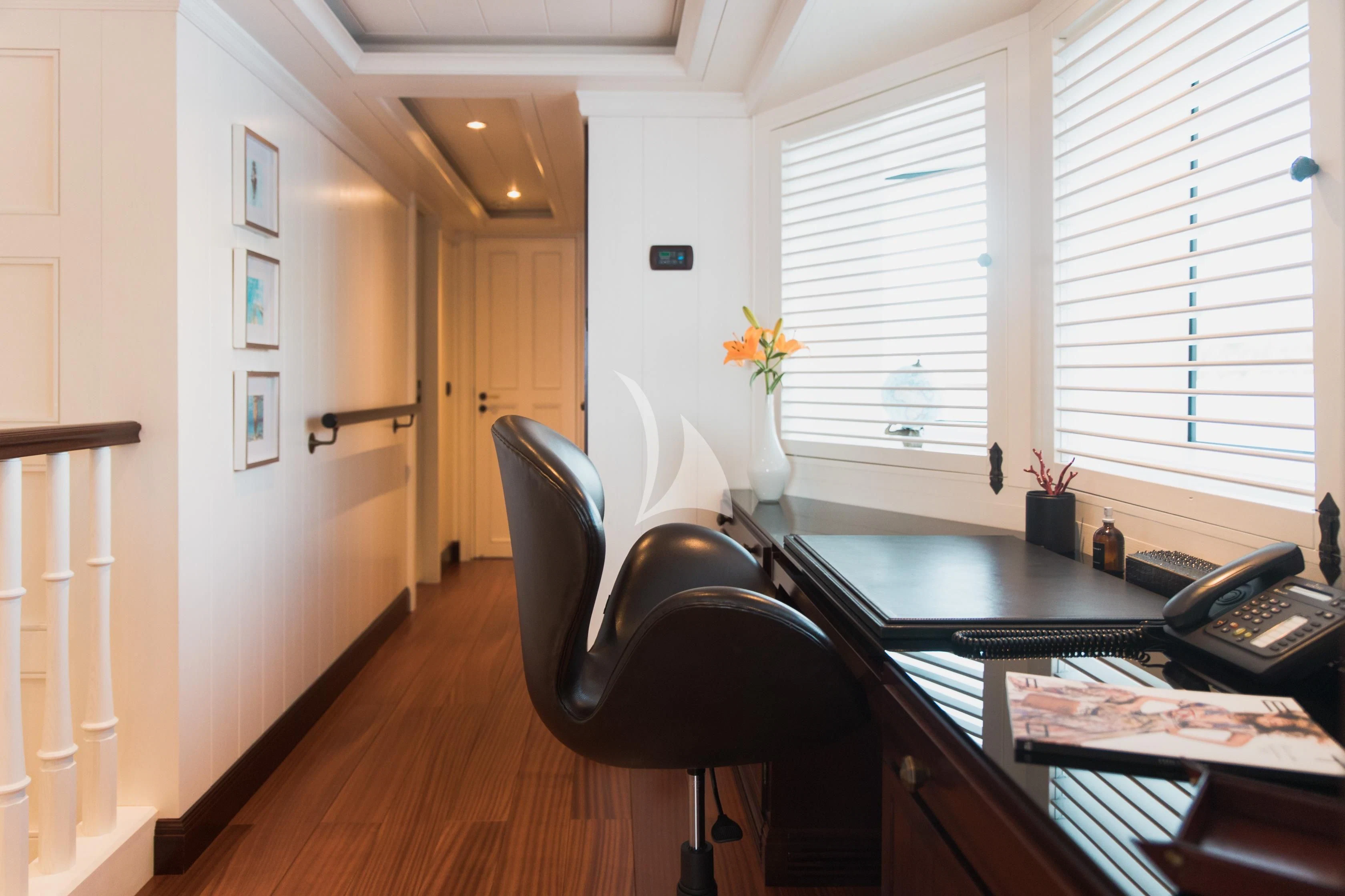 a room with a desk and a chair aboard LADY TRUDY Yacht for Charter