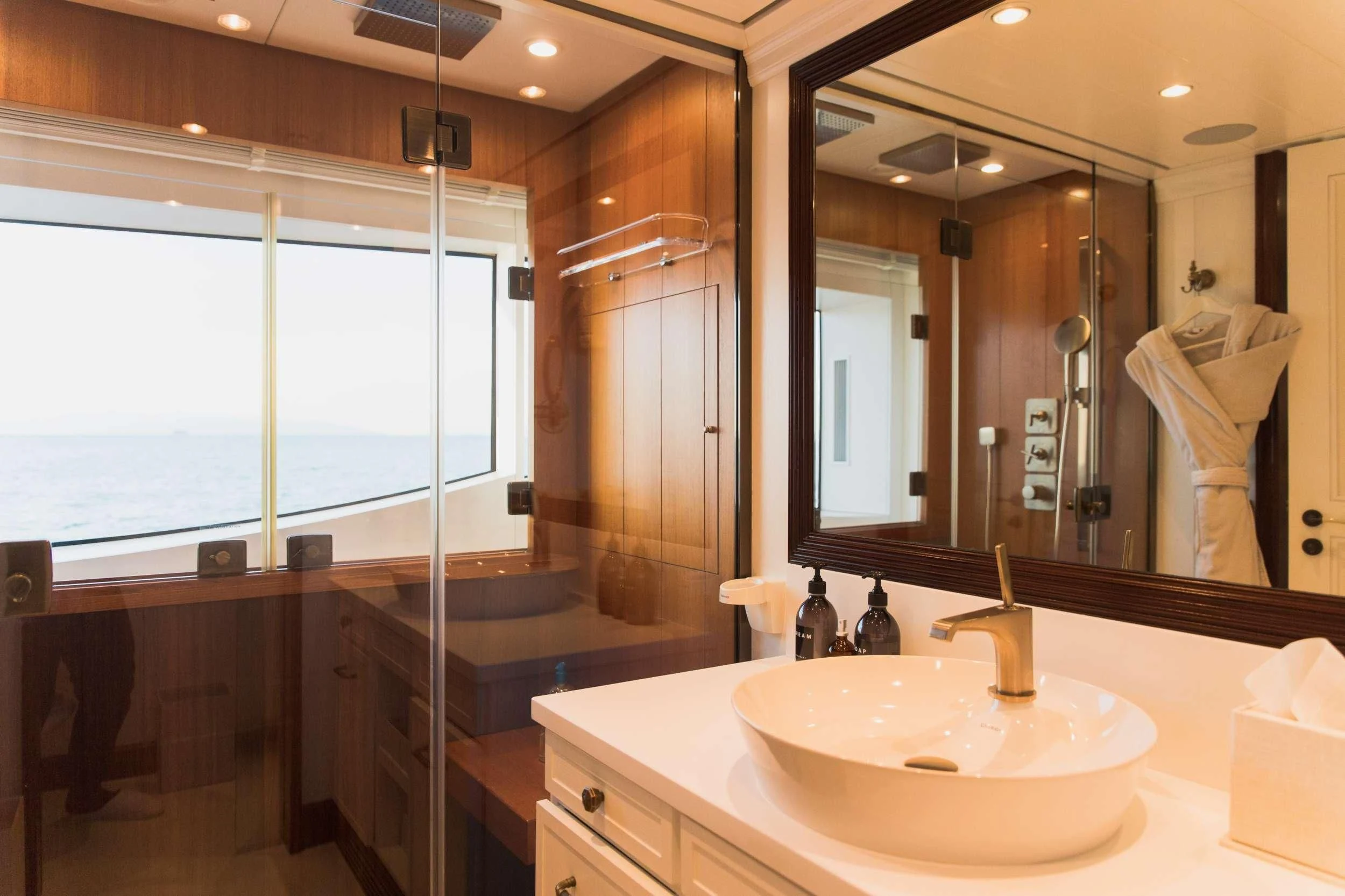 a bathroom with a large mirror aboard LADY TRUDY Yacht for Charter