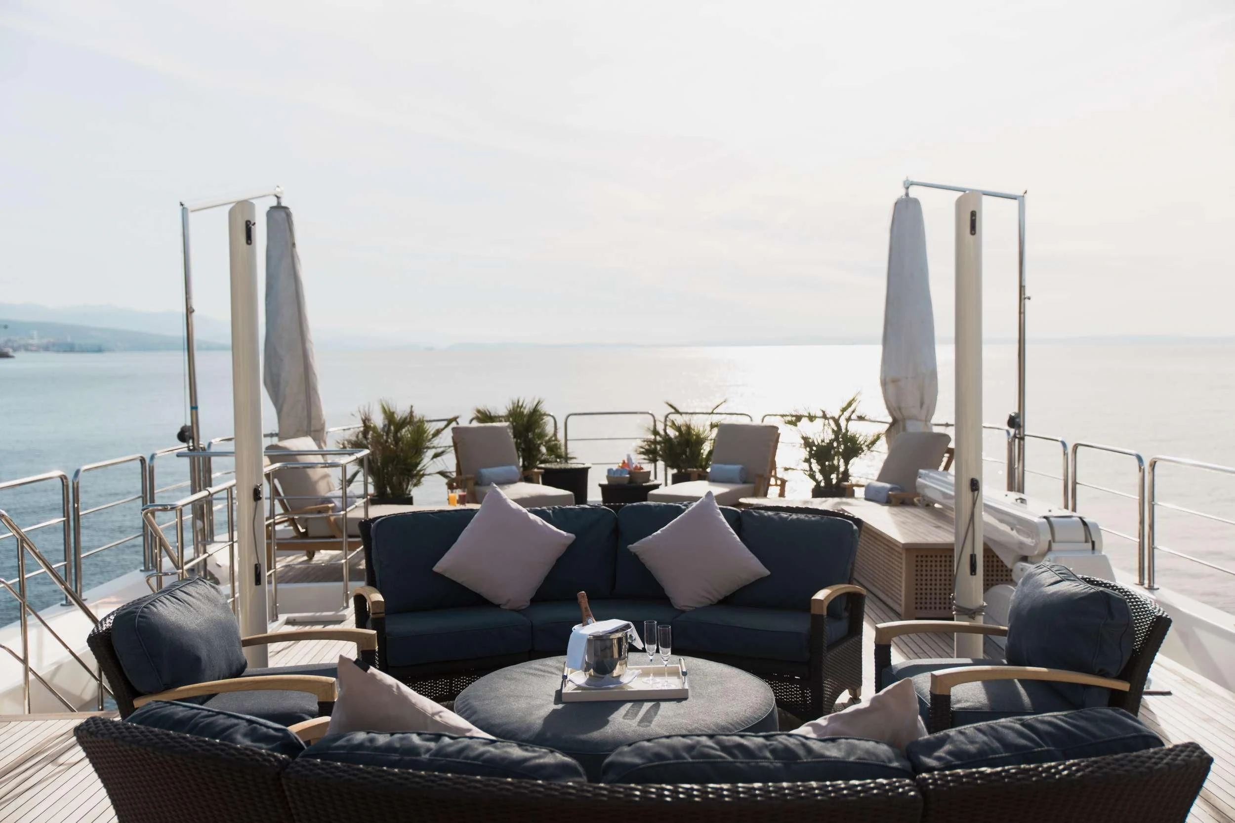 a living room with a large balcony aboard LADY TRUDY Yacht for Charter