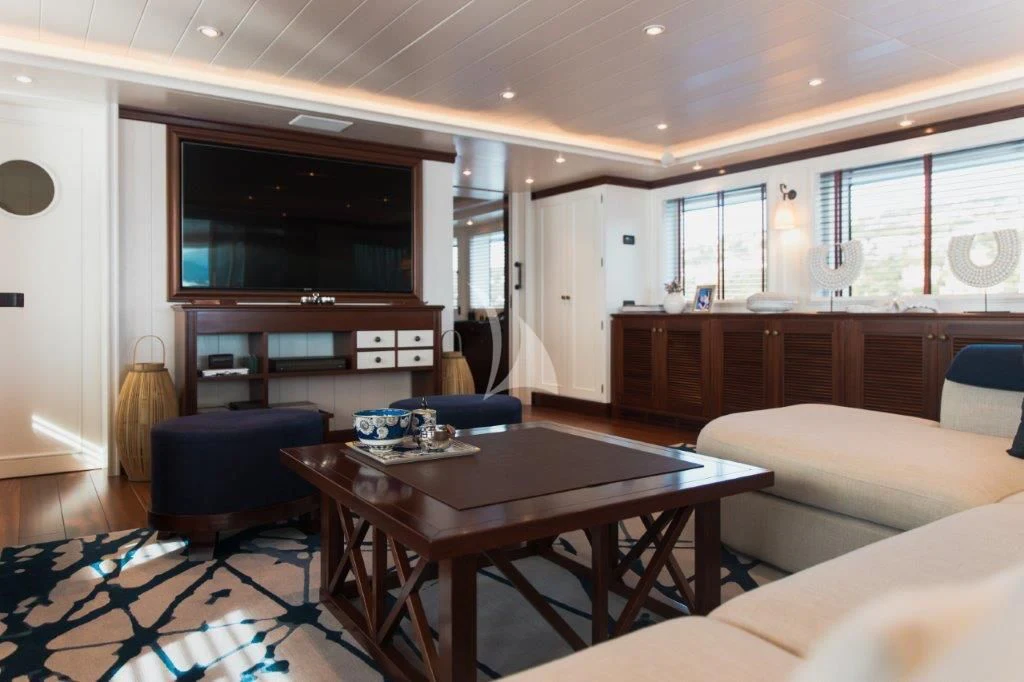 a living room with a table and chairs aboard LADY TRUDY Yacht for Charter