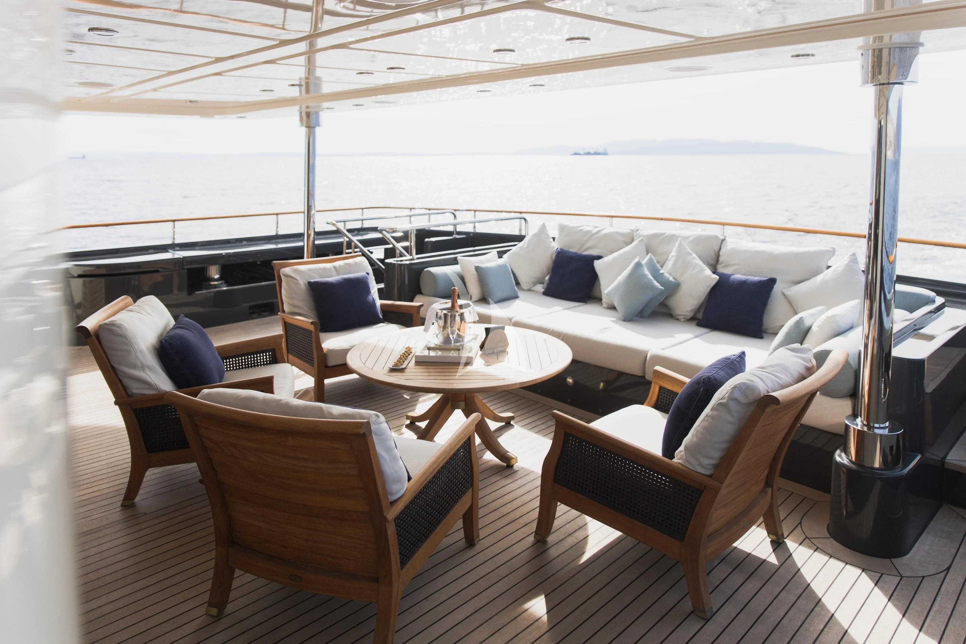 a room with a couch and chairs aboard LADY TRUDY Yacht for Charter