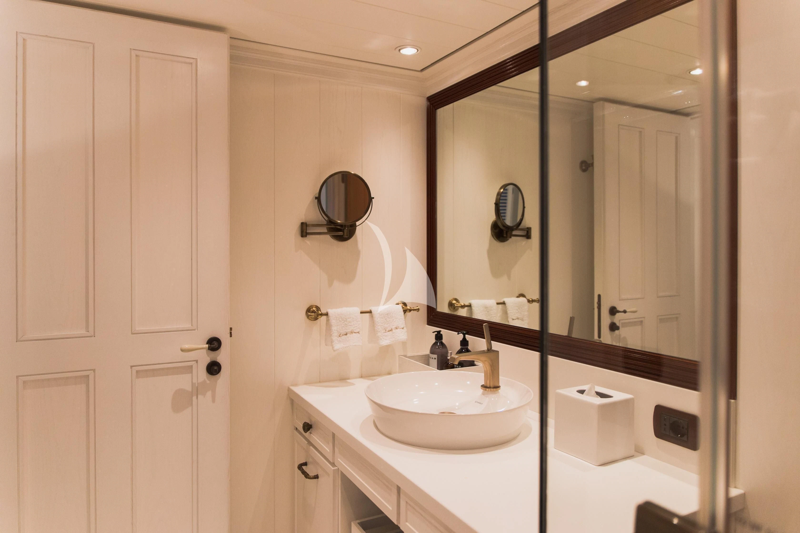 a bathroom with a large mirror aboard LADY TRUDY Yacht for Charter