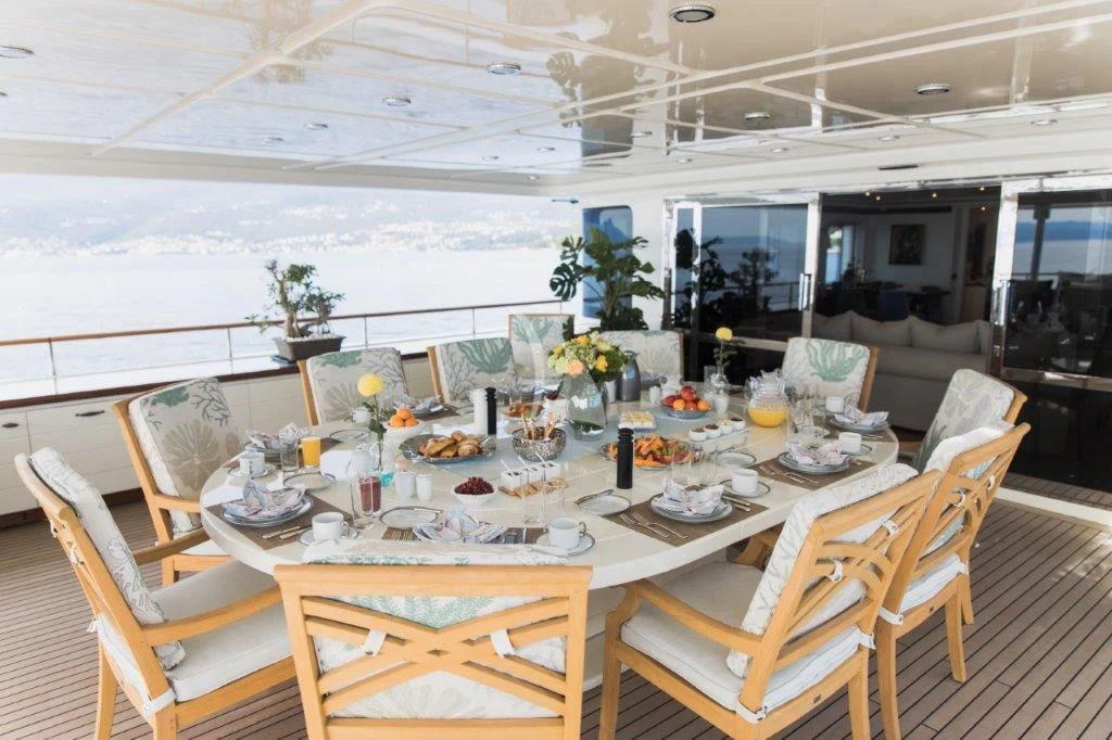 a table set for a dinner party aboard LADY TRUDY Yacht for Charter