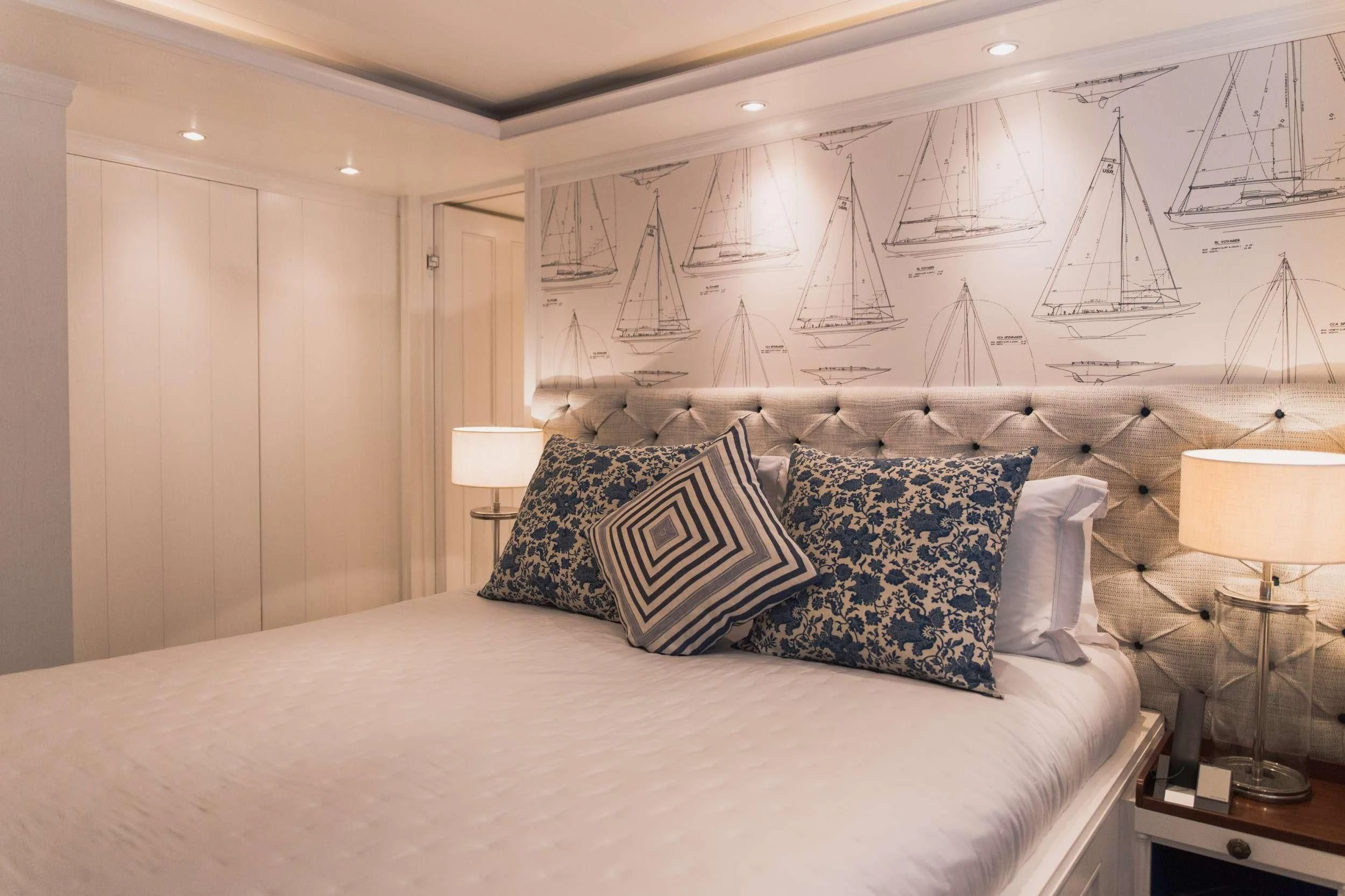 a bed with white sheets and pillows aboard LADY TRUDY Yacht for Charter