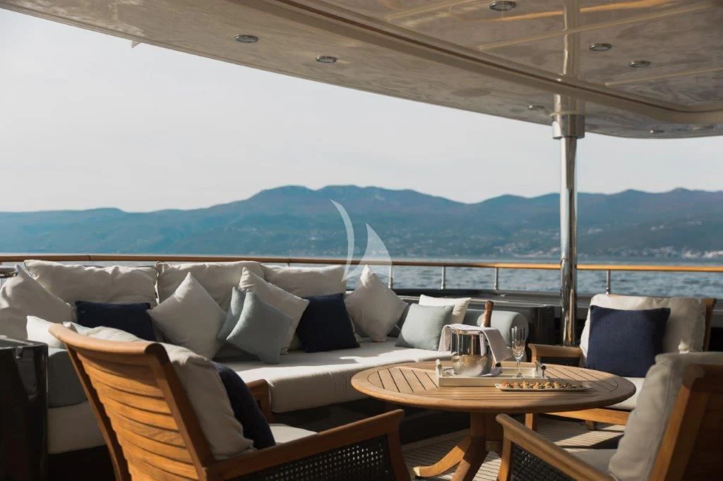 a room with a table and chairs aboard LADY TRUDY Yacht for Charter