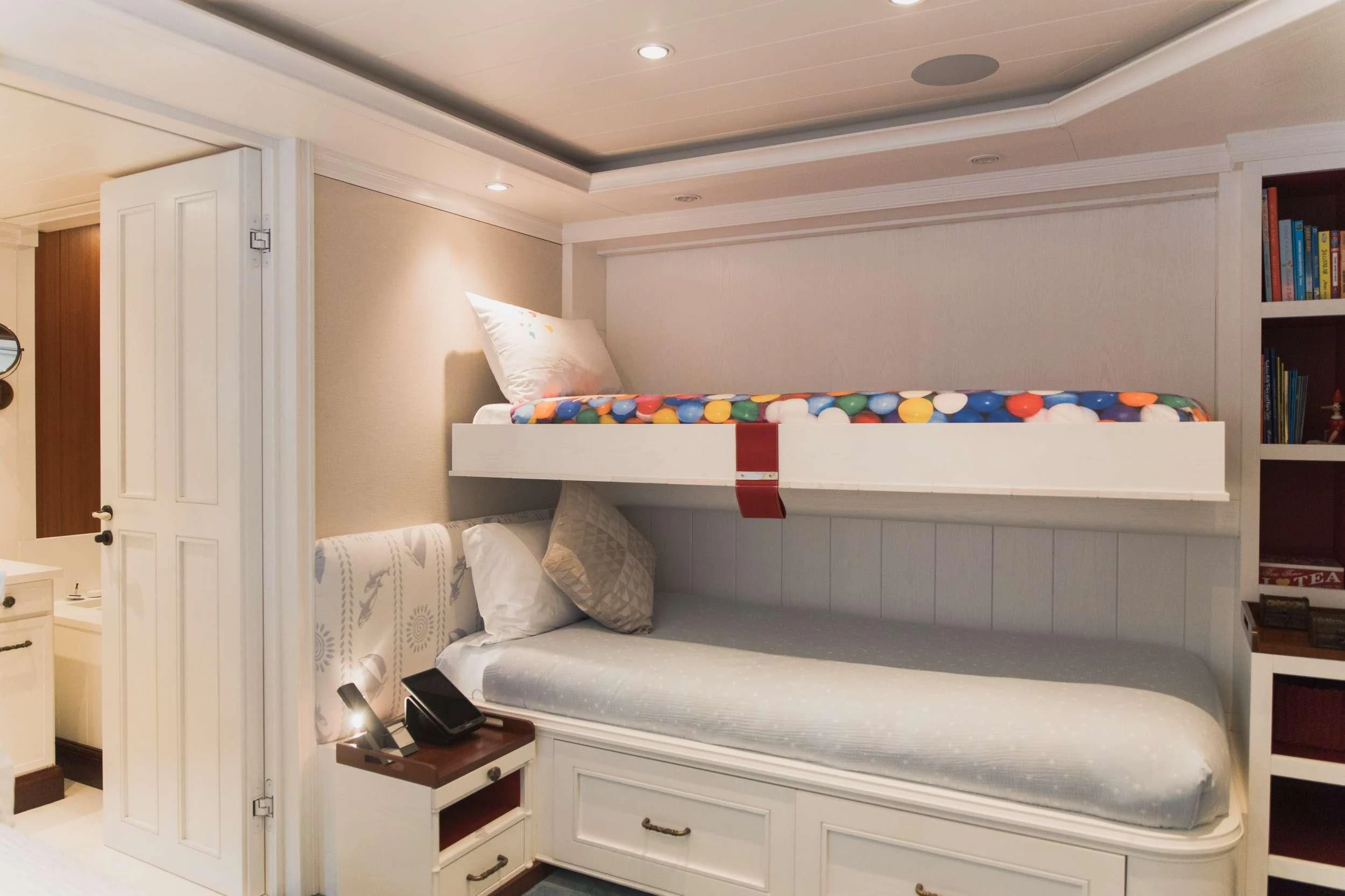 a bed with a white bed spread aboard LADY TRUDY Yacht for Charter