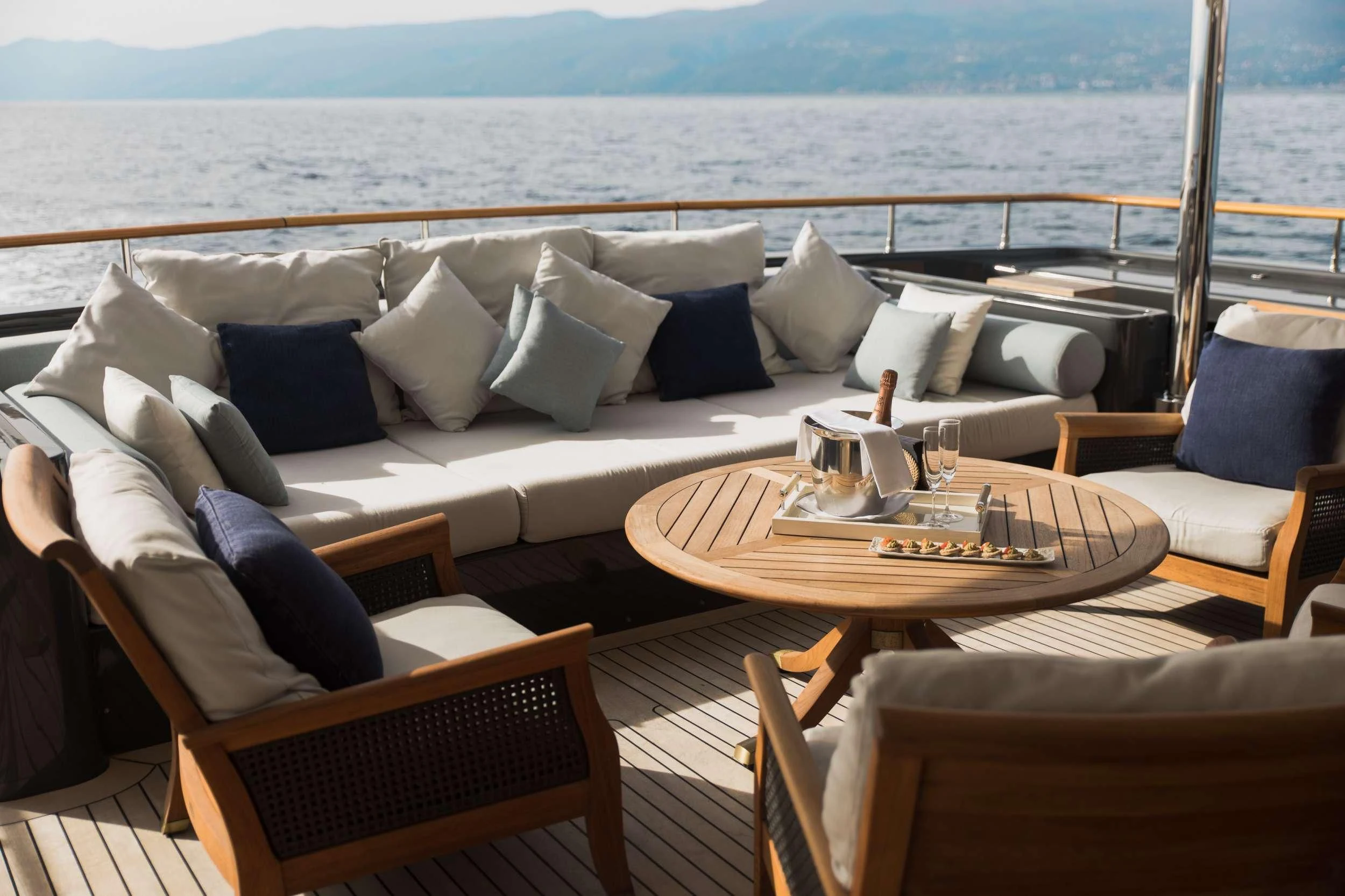 a living room with a large balcony aboard LADY TRUDY Yacht for Charter