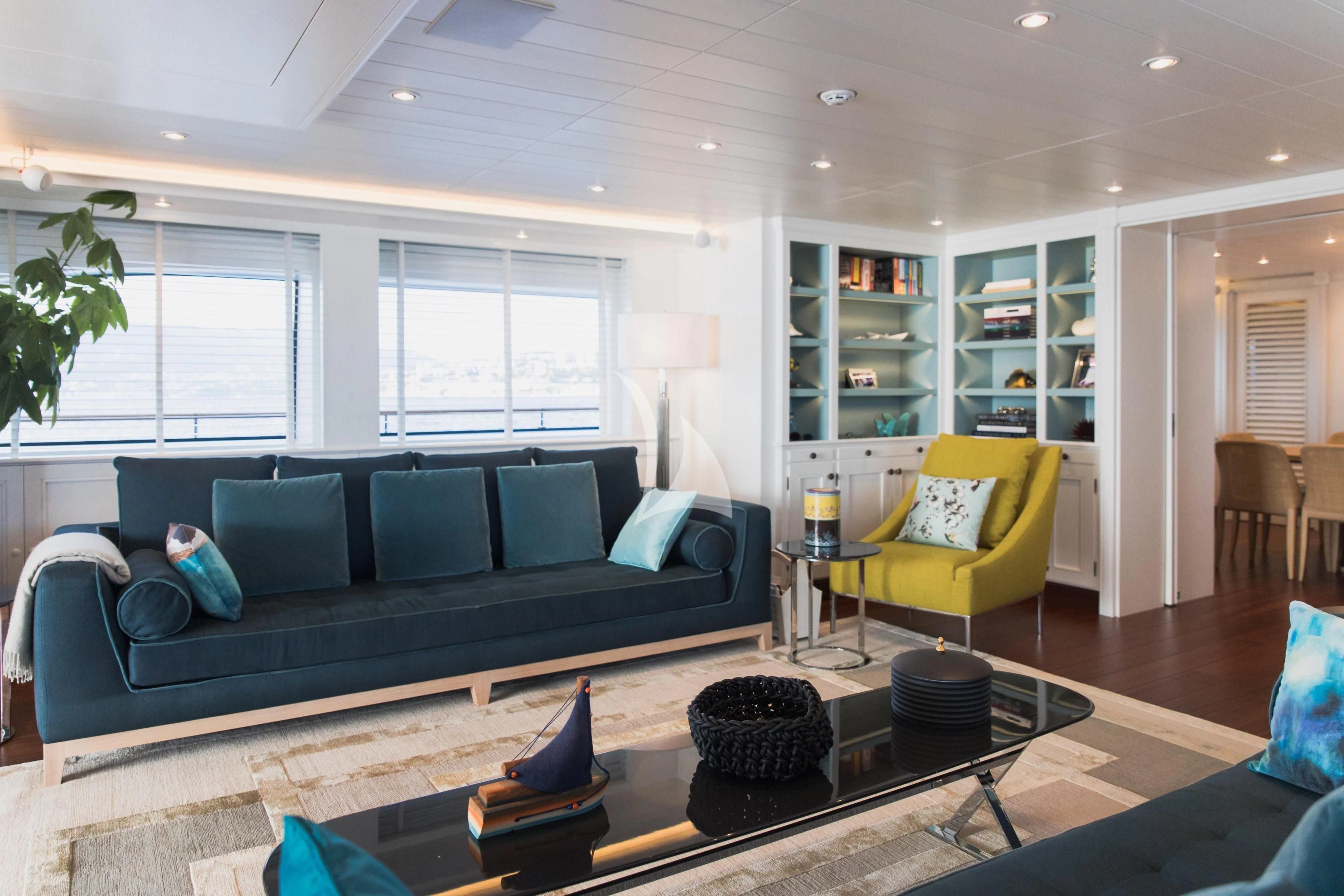 a living room with a couch and a coffee table aboard LADY TRUDY Yacht for Charter