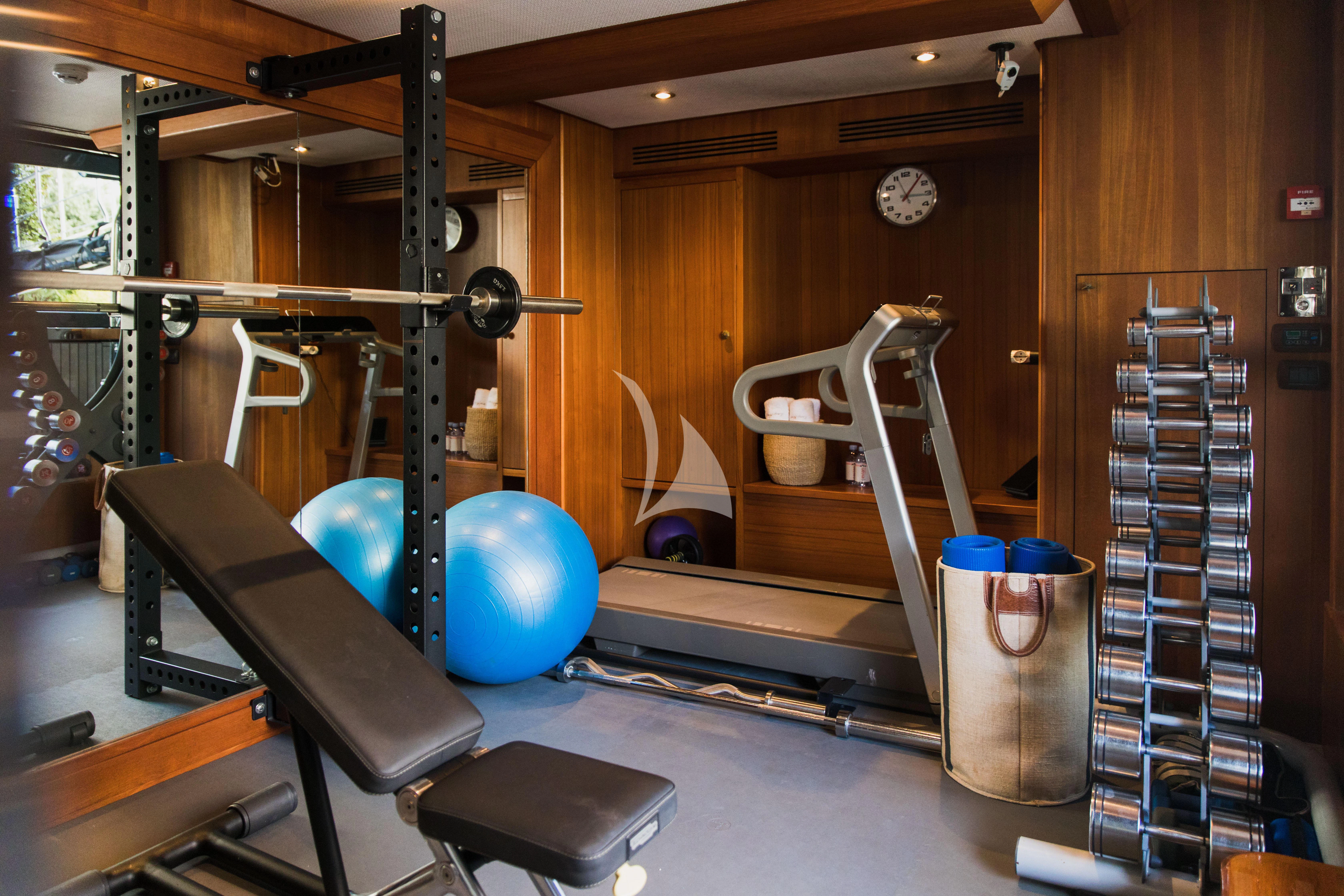 a gym with exercise equipment aboard LADY TRUDY Yacht for Charter