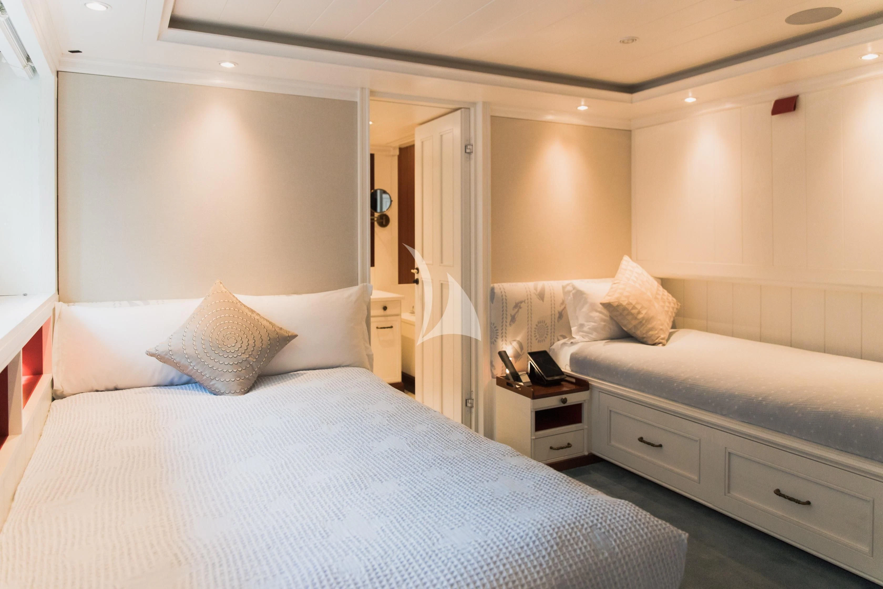 a hotel room with two beds aboard LADY TRUDY Yacht for Charter