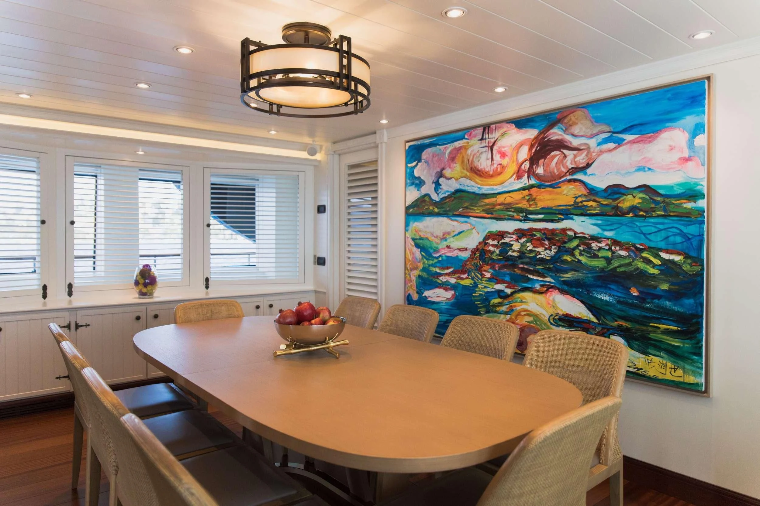a large room with a large painting on the wall aboard LADY TRUDY Yacht for Charter