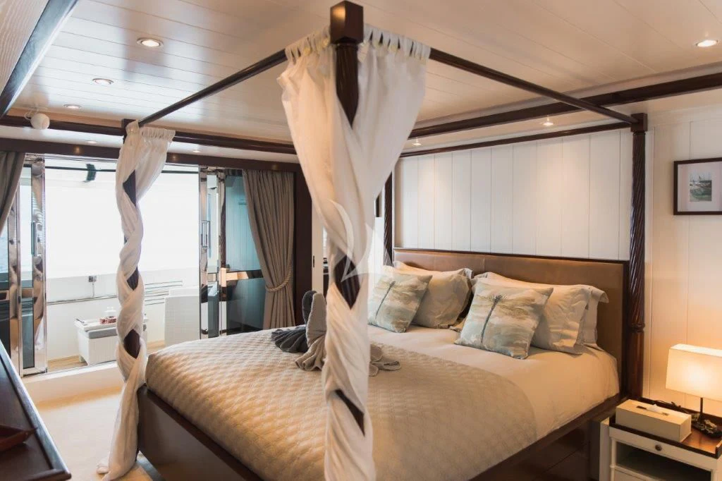 a bed with a canopy aboard LADY TRUDY Yacht for Charter