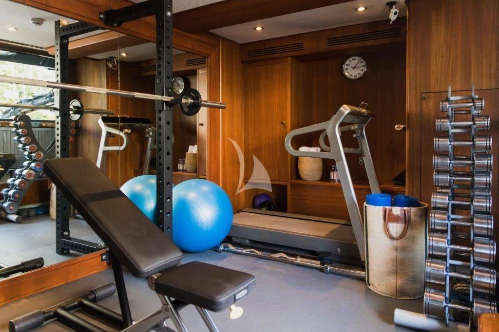 a gym with exercise equipment aboard LADY TRUDY Yacht for Charter