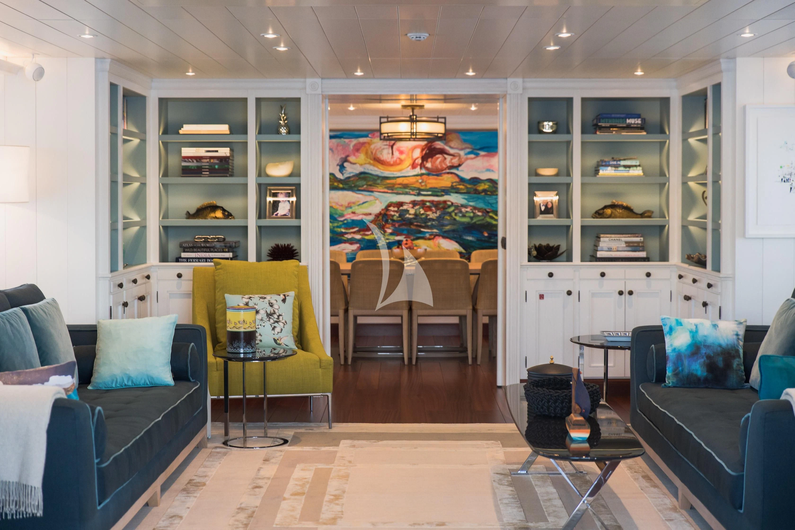 a living room with a large mirror aboard LADY TRUDY Yacht for Charter