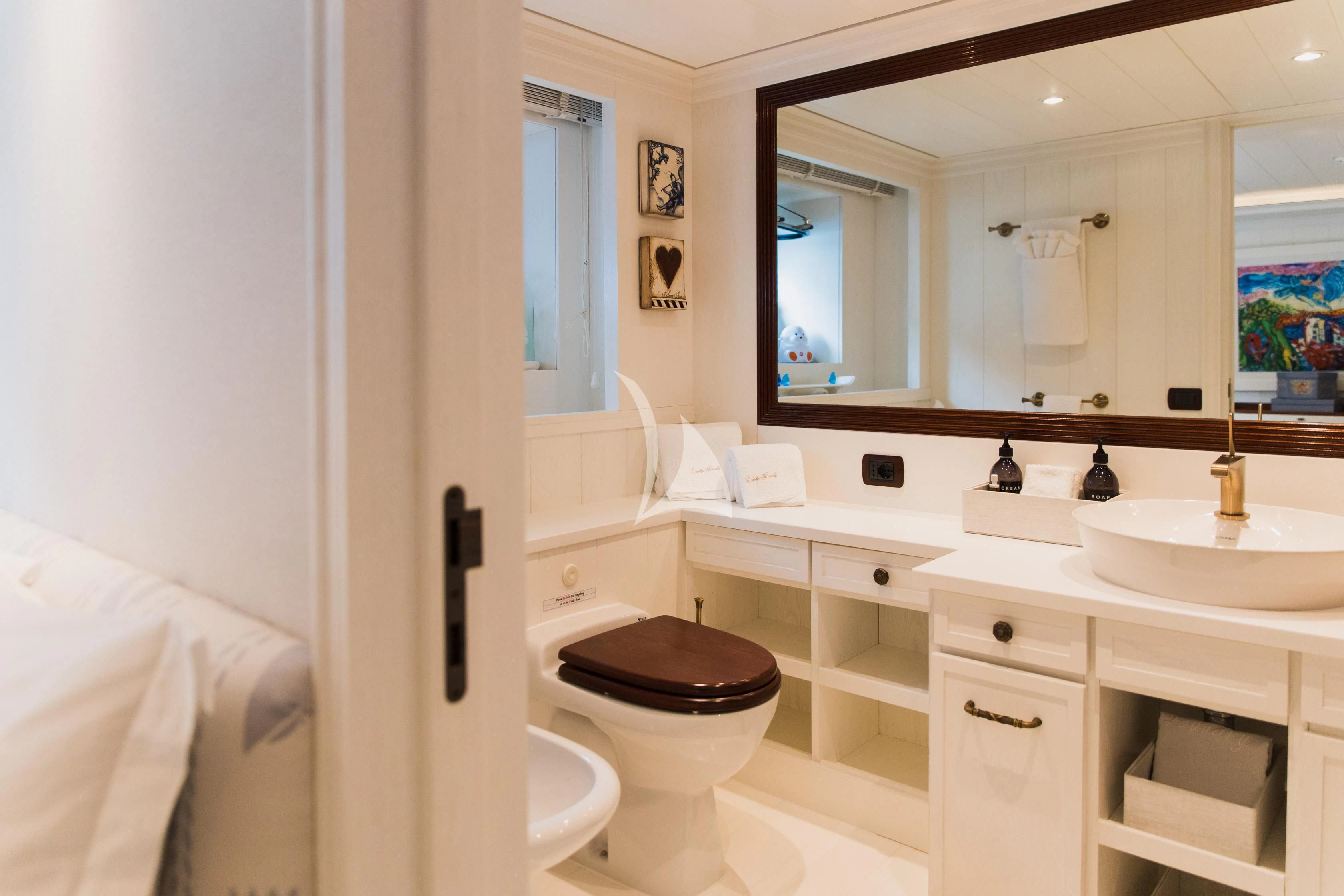 a bathroom with a toilet and a sink aboard LADY TRUDY Yacht for Charter