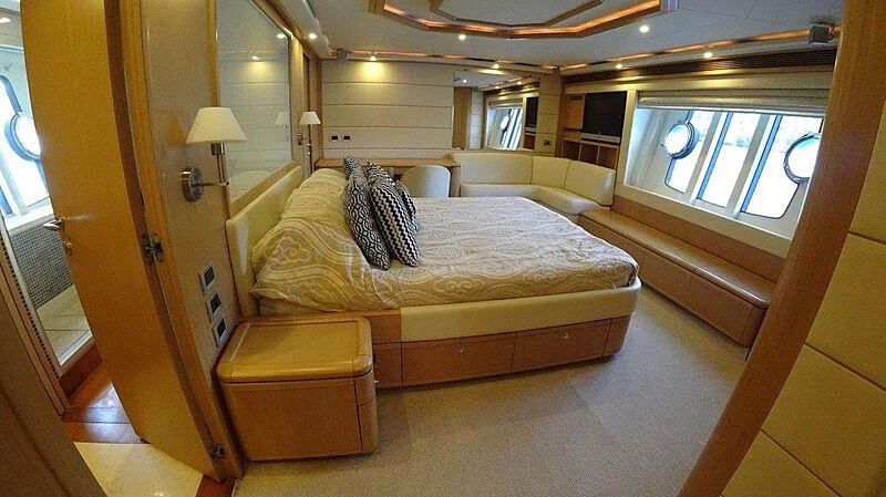 a room with a bed and a window aboard FAIR LADY SILVIA Yacht for Sale