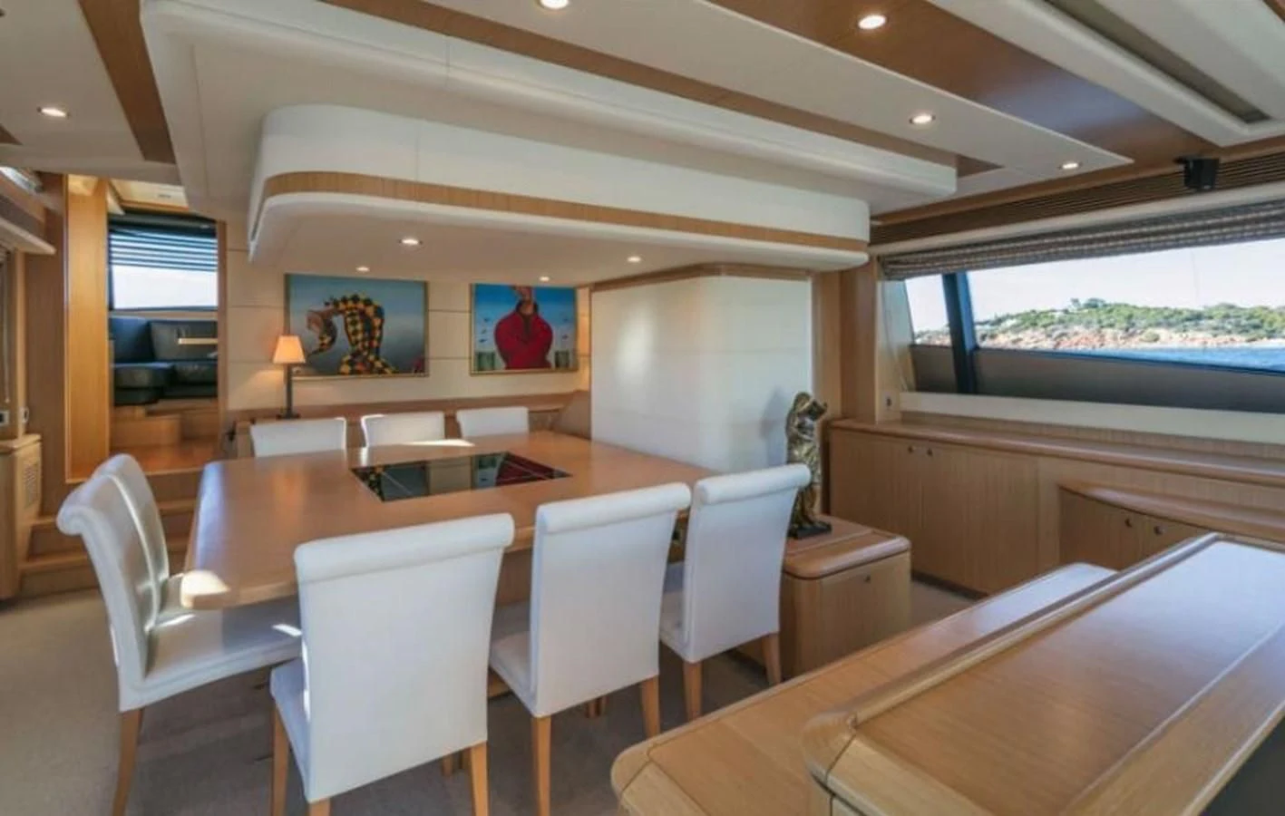 a room with a table and chairs aboard FAIR LADY SILVIA Yacht for Sale