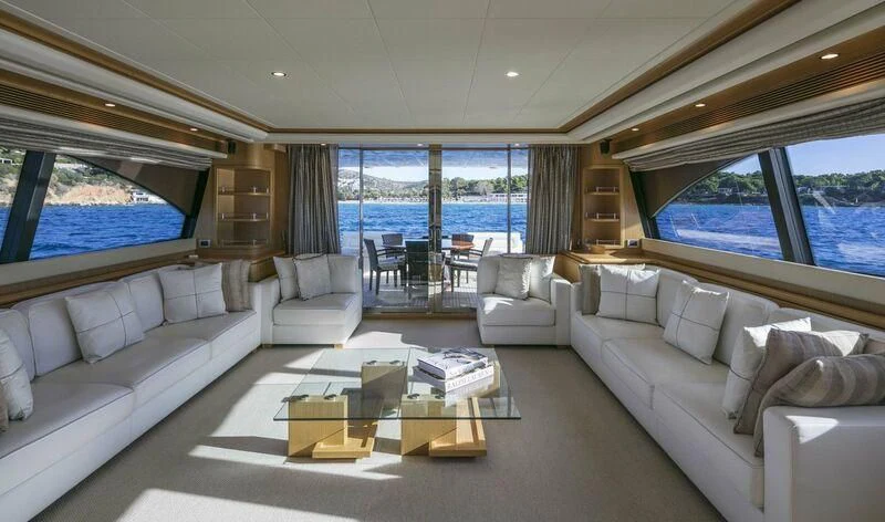 a living room with a large window aboard FAIR LADY SILVIA Yacht for Sale