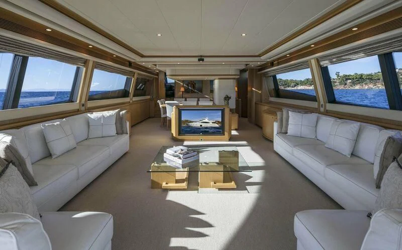 a living room with a large television aboard FAIR LADY SILVIA Yacht for Sale