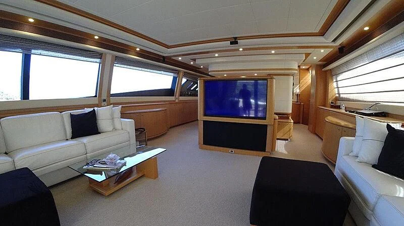 a living room with a large screen aboard FAIR LADY SILVIA Yacht for Sale