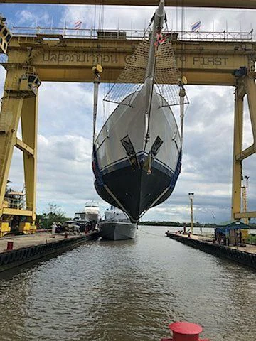 a large ship in a harbor aboard VELA Yacht for Sale