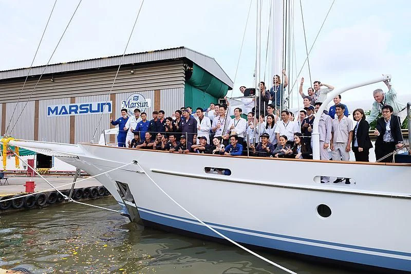 a group of people on a boat aboard VELA Yacht for Sale