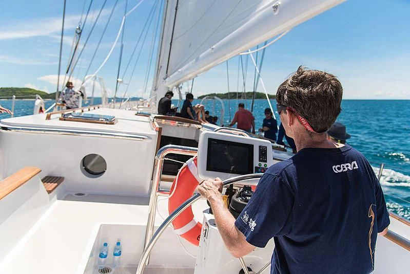 a man on a boat aboard VELA Yacht for Sale